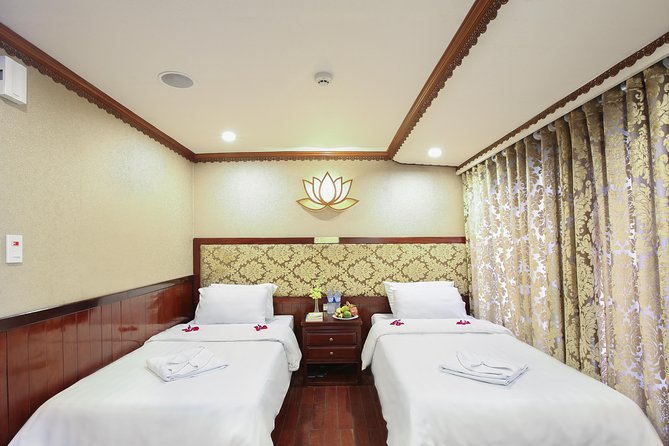 2-Day Oriental Sails Junk Cruise of Halong Bay - Day 1: Embark, Sung Sot Cave, Titop Island, and Sunset Happy Hour