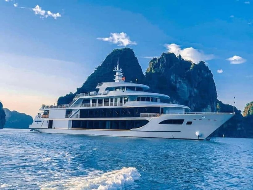 7 hours to discover HaLong Bay on Luxury Day Cruise - Check-in, drum performance, and sailing by 9:00
