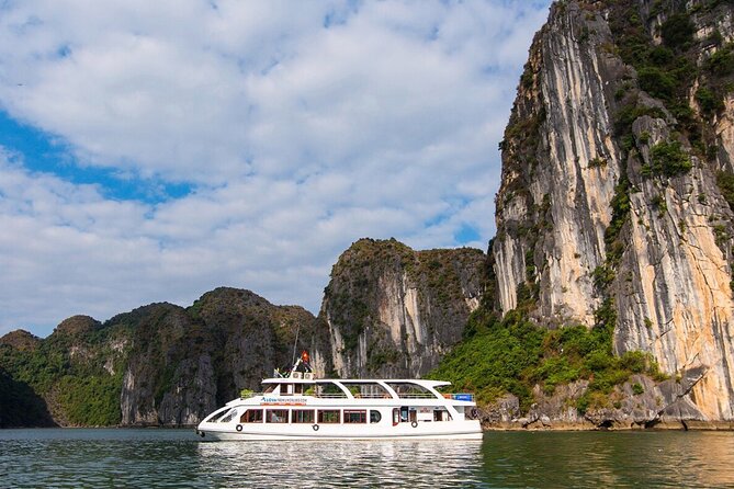 DELUXE Halong Cruise 1 Day Tour From Hanoi - Daily Operated - Boarding at Tuan Chau: the welcome, safety brief, and ship comfort