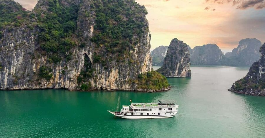 From Hanoi: 2-Day Ha Long Bay Boat Tour - Day 1 in Ha Long Bay: Sung Sot Cave, Titop Island, and spring rolls