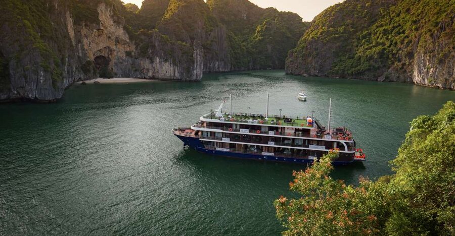 From Hanoi: 2-Day Halong and Lan Ha Bay La Pandora Cruise - Day 2: sunrise views, Dark and Bright Cave by local rowing boat