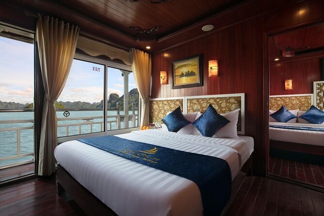 From Hanoi: 2D1N Ha Long Bay Deluxe Cruise with Bus Limousine - Day 1: Check-In, Titop Island Swim Time, and a Deck Sunset Party