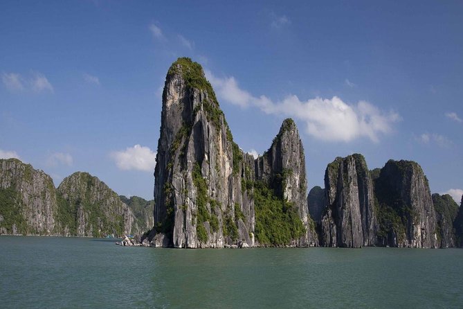 Full-Day Halong Bay Tour Including Kayaking from Hanoi - Traditional junk boat cruise: what you will see between stops