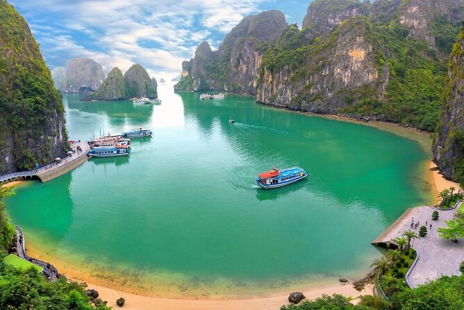 HaLong Bay Day Cruise with Kayaking, Swimming, Hiking and Lunch - Titop Island: beach, views, and the climb that frames the bay