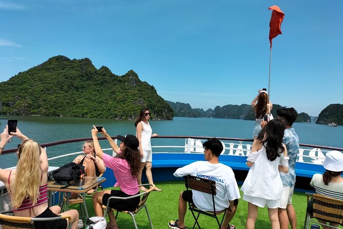 Halong Bay Day Tour With Titop Island, Cave, Kayak & Lunch - Sunset party on the return: the snack is part of the pacing