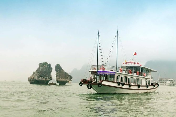 Halong Bay Islands and Caves: Full-Day Tour from Hanoi - Floating Village bamboo boat ride, then 40 minutes of kayaking