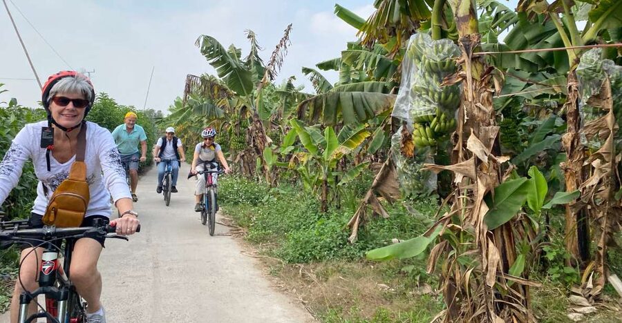 Hanoi: Bike Tour Through Hidden Gems and Banana Island - Sang and the guide team: why the English narration matters