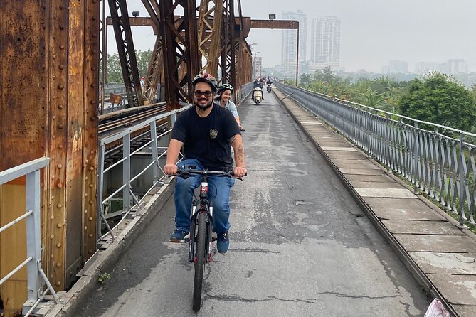 Hanoi City Bike Tour through Banana Island & Food Tasting - The railway tracks and cafes: a Hanoi detail you cannot invent yourself