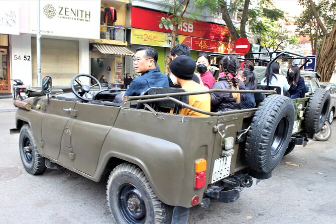 Hanoi Jeep Tours Led By Women: City & Red River Half Day - Duờng Tàu and lunch by the tracks, where life runs centimeters away