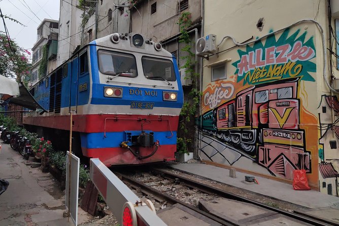 HANOI MUST SEE SITES Vespa Tour - Long Bien Bridge and the mosaic wall crossing