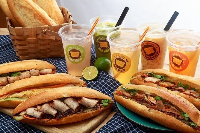 Hanoi Street Food: Small Group Walking Tour with Real Foodie - Entering Hanoi Old Quarter for food first, photos second