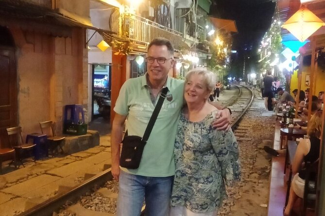 Hanoi Train Street Tour - Dong Xuan Market stop, then the train passes inches away