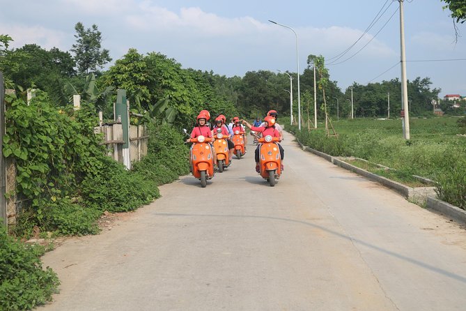 Hanoi Vespa Full Day City & Countryside with Female Ao Dai Riders - West Lake, Botanical Garden Paths, and the Huu Hiep Lake B52 Site