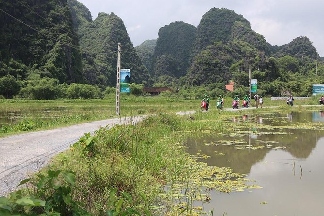 Hanoi Vespa Tour Explore Red River Delta & Rural Villages 5 Hours - The Hanoi backroad return: fruit break and a local family visit