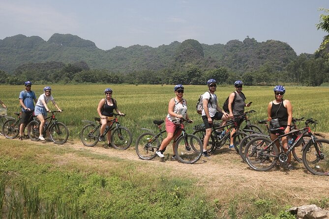 Hoa Lu - Tam Coc - Mua Cave 1 Day with Cycling, Hiking, Lunch - Tam Coc Bamboo Boat and Village Cycling: The Best Mix for Photos and Movement