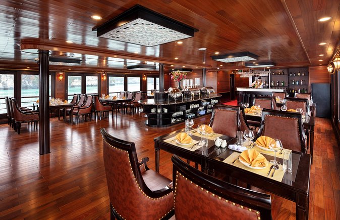 Luxury 4<em> Cruise 2Days 1night Ha Long Bay – V'spirit Premier Cruise – Key Things That Make This Cruise Worth Your Time’ /></p>
<ul>
<li><strong>Lan Ha Bay, not the busy main lane</strong>: you get the southern Halong Bay side, with dramatic limestone scenery but a calmer feel.</li>
<li><strong>Dark and Bright caves on sampans</strong>: a local, hands-on way to reach the caverns and see how people live around the water.</li>
<li><strong>Tai Chi at sunrise from the top deck</strong>: a simple, peaceful start that turns the morning into an event.</li>
<li><strong>Kayaking in the Tra Bau area</strong>: you get hands-on movement instead of only viewing from the ship.</li>
<li><strong>Chef cooking demonstration plus full-board meals</strong>: local flavors explained and then served, with meals included across both days.</li>
</ul>
<h2>From Hanoi to the Harbor, The Day Starts Smooth</h2>
<p><img width="669" height="446" decoding="async" src=
