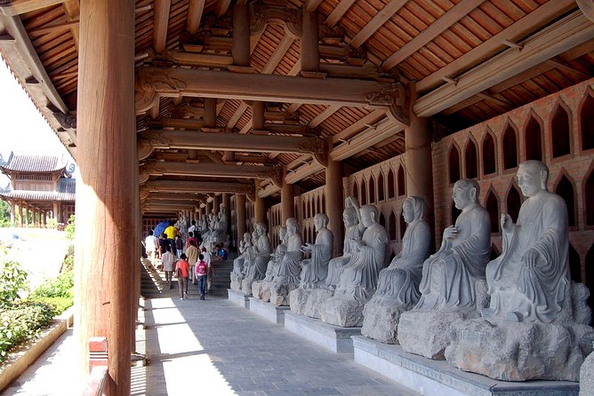 Luxury Bai Dinh - Trang An - Mua Cave with Buffet Lunch - Bai Dinh Pagoda: big Buddha energy, plus record-setting details