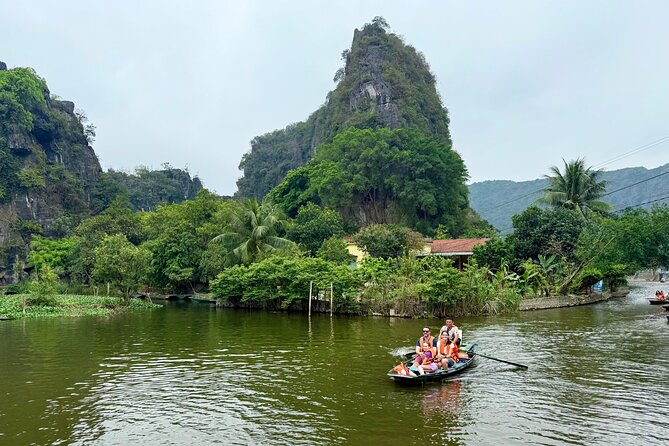 Ninh Binh Day Escape from Hanoi: Local Life, Connection & Tales - Sampan Boat Through Tam Coc: Limestone Cliffs and Cave Passages