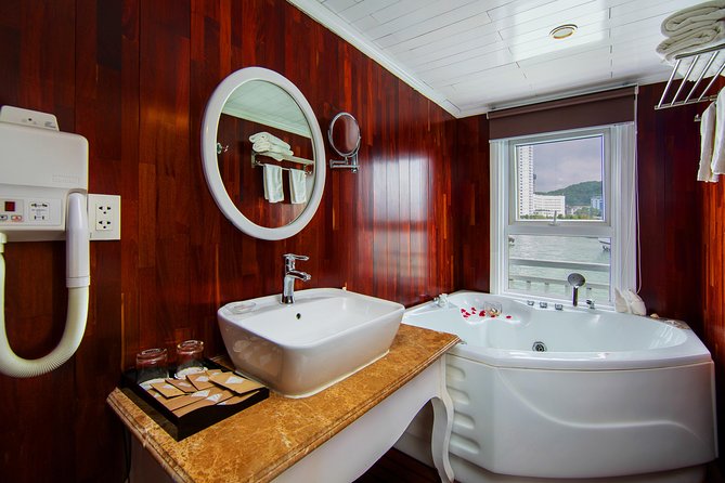 (Official) Signature Royal Cruise - 03 days 02 nights program - Day 2: tai chi at 06:30, kayaking on a day boat, and squid fishing at night