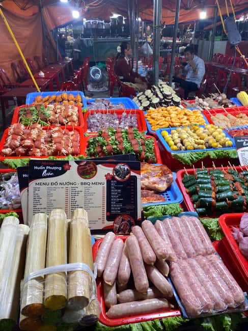 Sapa Night Market Experience – BBQ, Hotpot & Black Chicken - Walking the night market with a guide who handles the awkward bits
