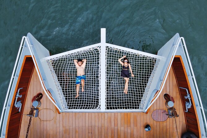 The Halong Catamaran Premium Day Cruise From Ha Long Bay - Ha Long Bay water time: kayaking or bamboo boat to the Bright-Dark Cave area