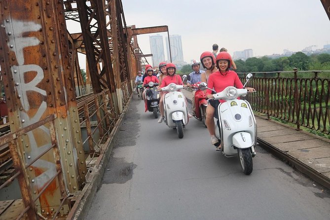 Vespa City Tour &Train Street Female With Ao Dai Riders 4,5 Hours - Ba Đình Square area drive-by for the big-photo context